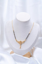 Wing Diamond Mangalsutra on jewellery stand - Nyara