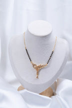 Filigree Vine Diamond Mangalsutra flat lay on peach background - Nyara