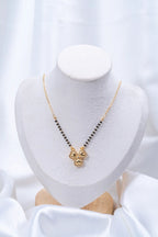Four Heart Clover Diamond Mangalsutra flat lay on peach background - Nyara