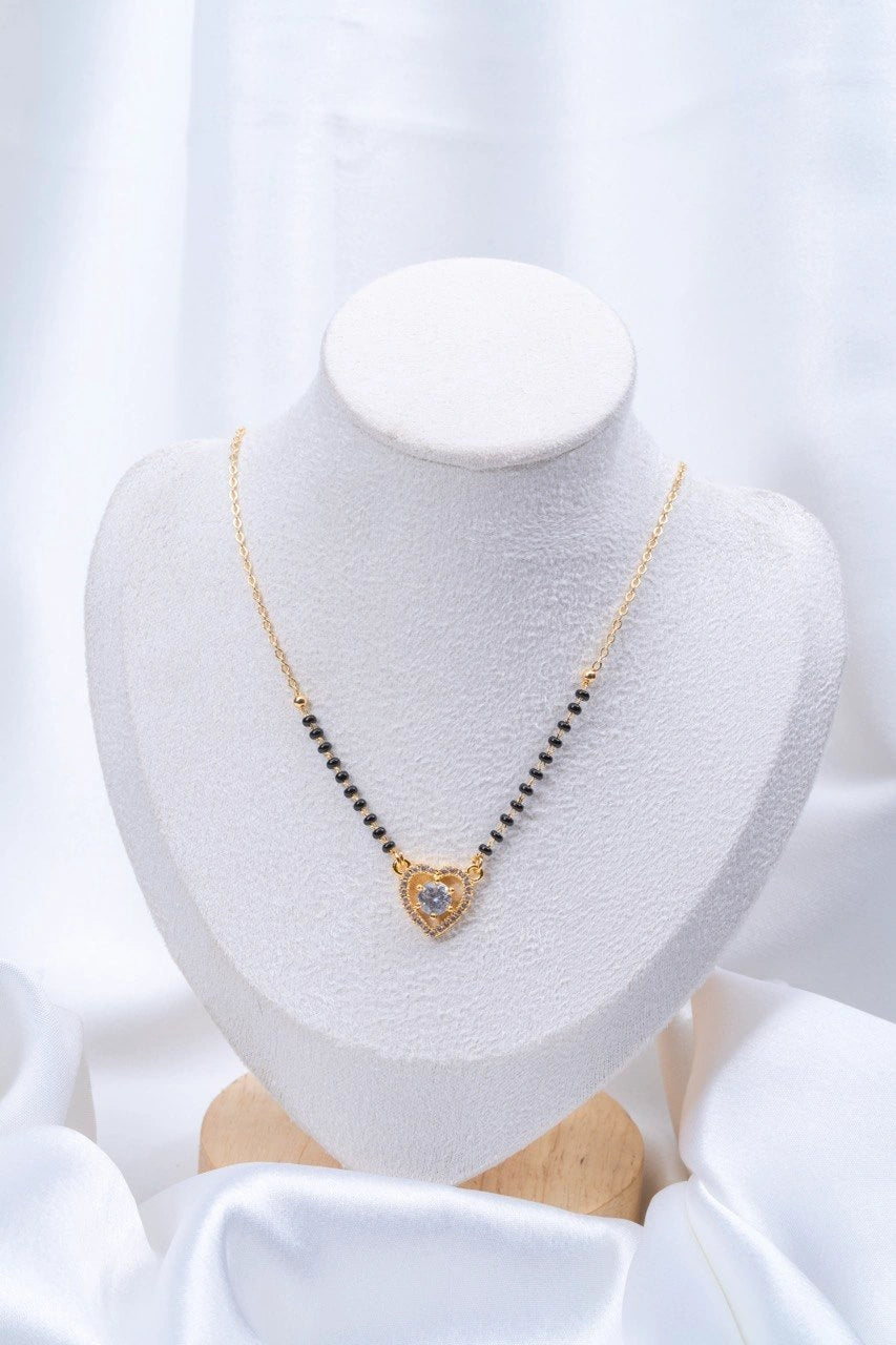 Heart Solitaire CZ Mangalsutra flat lay on peach background - Nyara