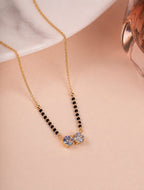 Double CZ Solitaire Mangalsutra on jewellery stand - Nyara