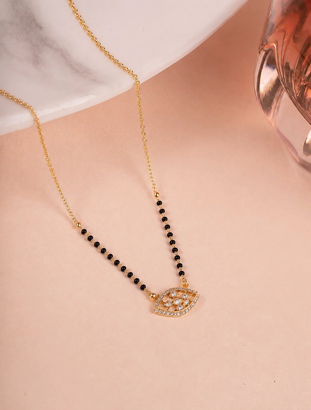 Evil Eye Diamond Mangalsutra on jewellery stand - Nyara