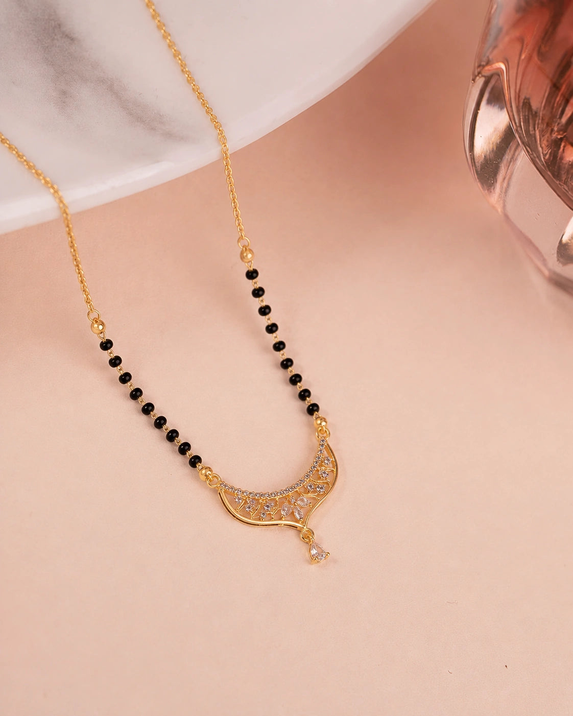 Crescent Moon Diamond Mangalsutra on jewellery stand - Nyara
