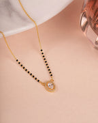 Oval Solitaire Diamond Mangalsutra on jewellery stand - Nyara