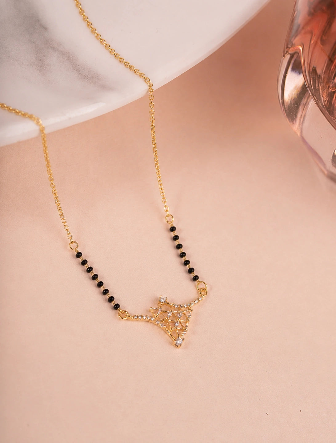 Diamond Lattice Net Mangalsutra on jewellery stand - Nyara