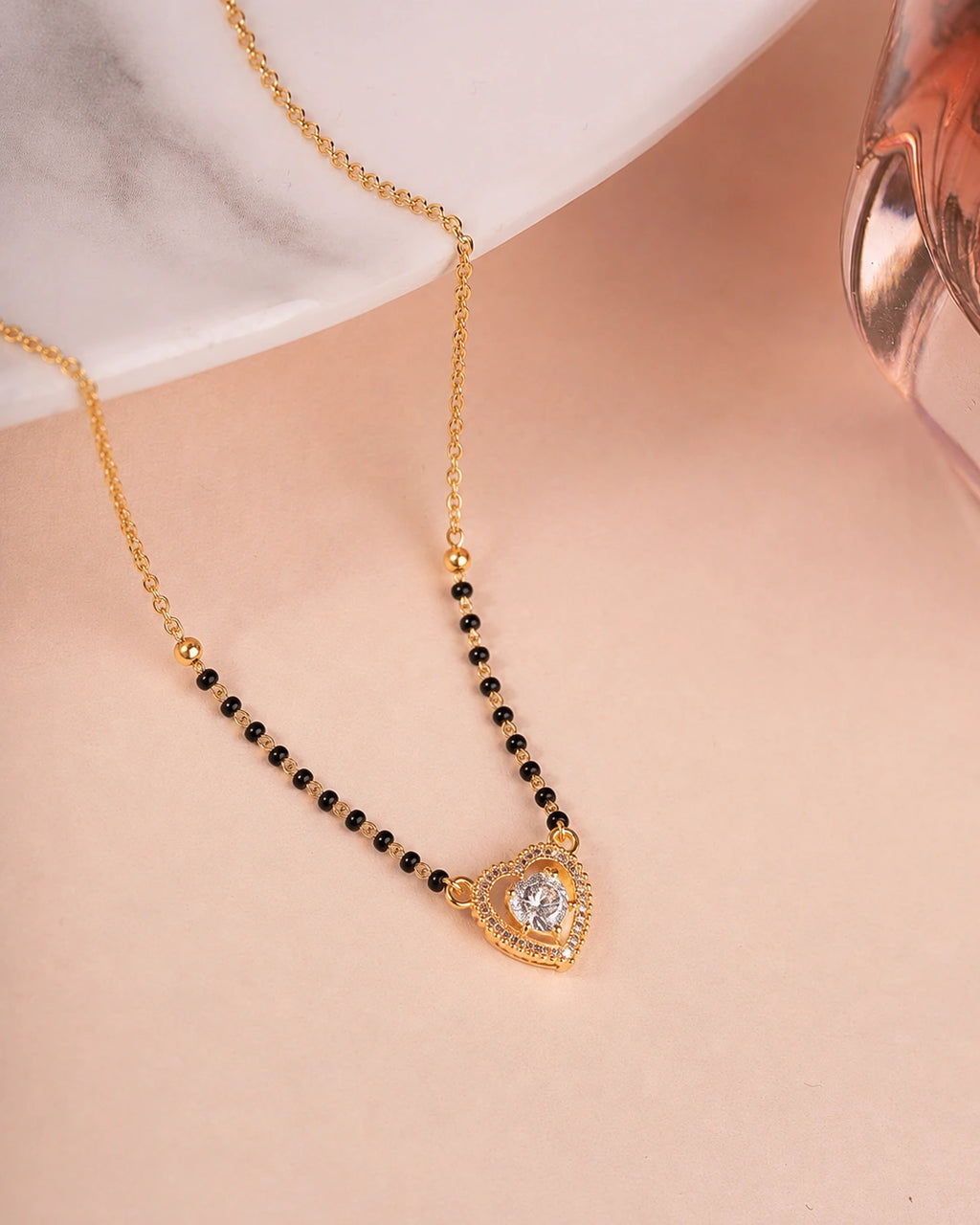 Heart Solitaire CZ Mangalsutra on jewellery stand - Nyara