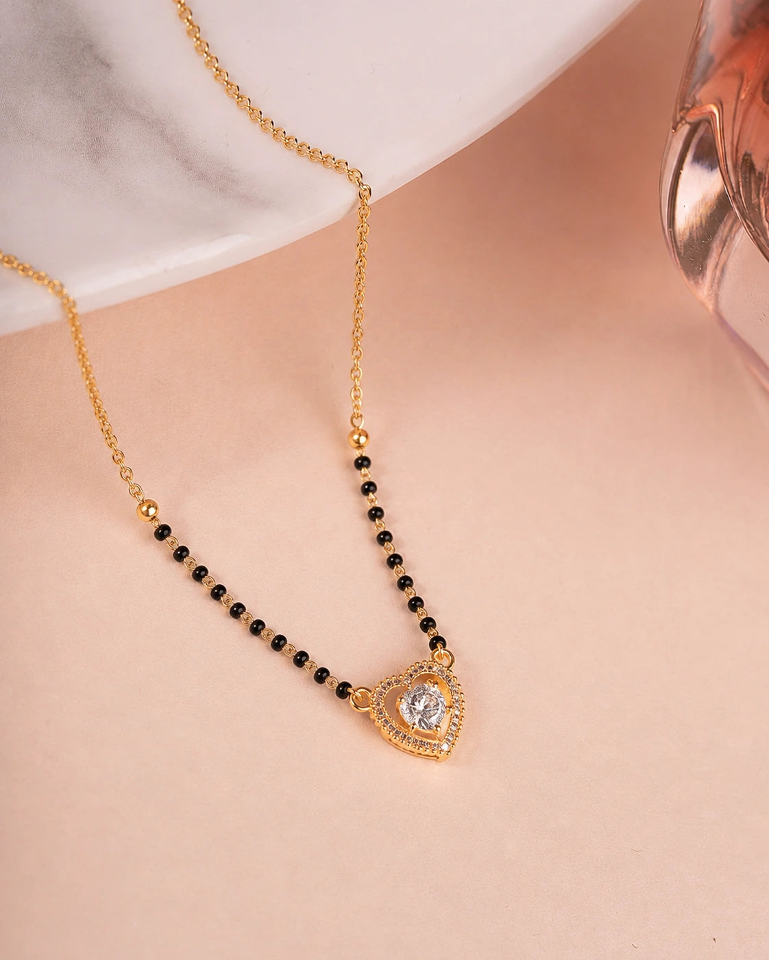 Heart Solitaire CZ Mangalsutra on jewellery stand - Nyara