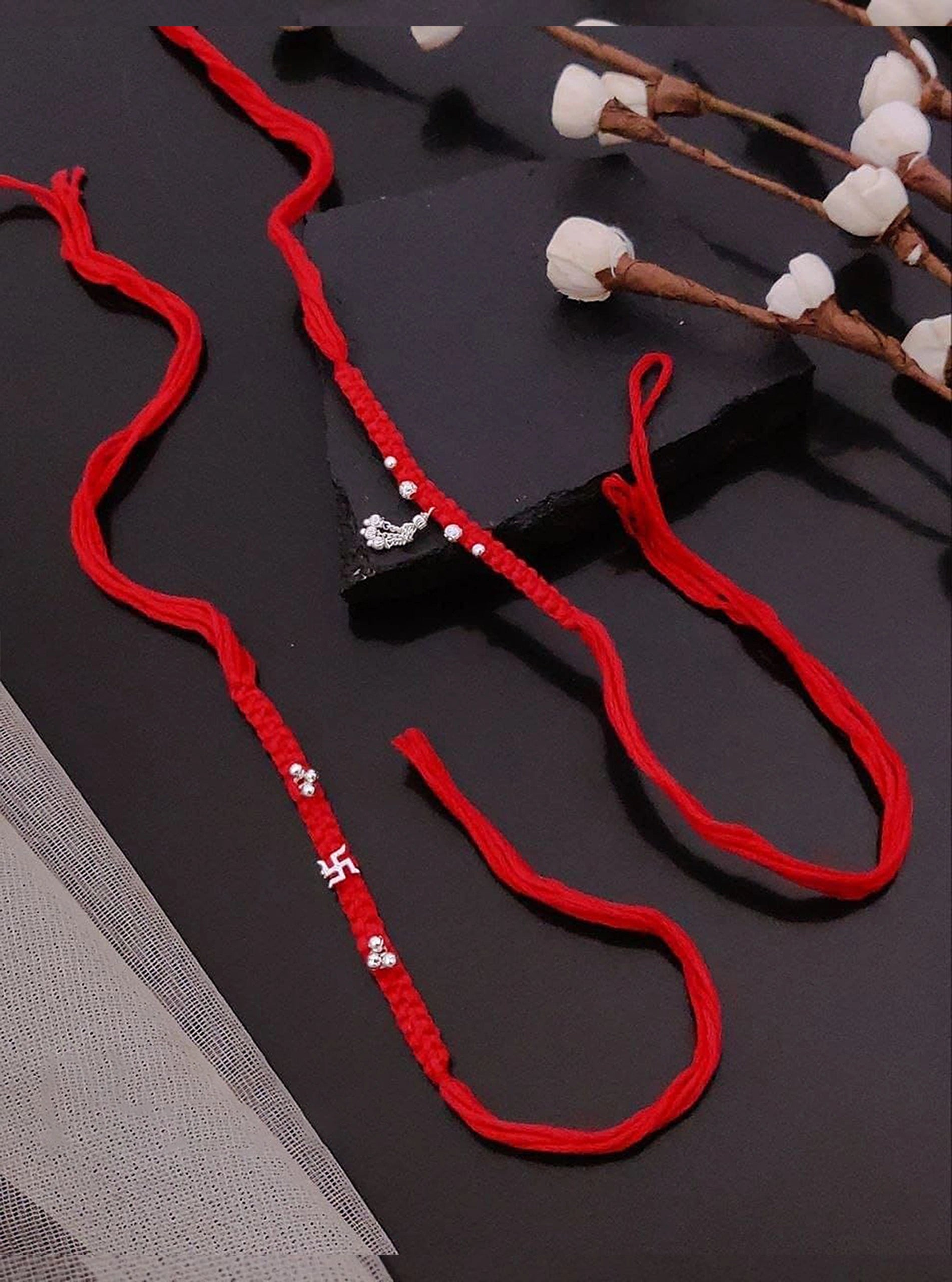 Ganesh Swastik Braid Rakhi Set - Red Thread with Silver Charms